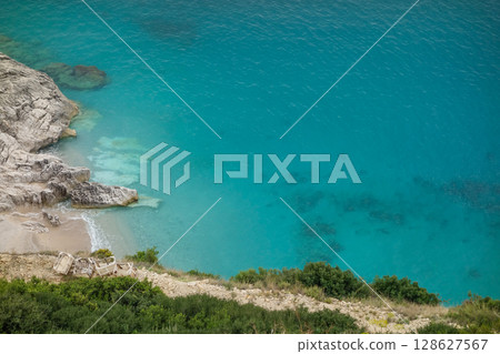 private and secluded paradise beach on the Albanian coast, aerial view 128627567