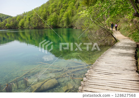 wooden platform between lakes of Plitvice Lakes National Park in Croatia 128627568
