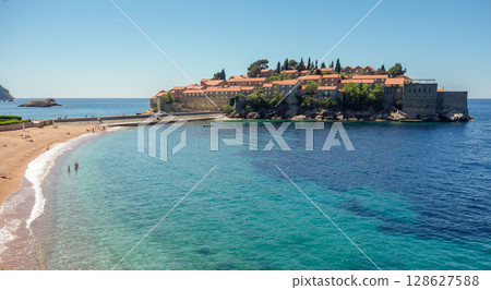 amazing Sveti Stefan beach in Budva riviera. Crystal clear waters on a sunny day 128627588