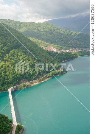 Piva lake and the city of Pluzine on background. Montenegro, Europe 128627596