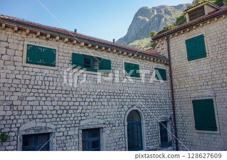 Kotor, Montenegro - 04.29.2025: facades of ancient buildings inside Kotor fort, old town 128627609