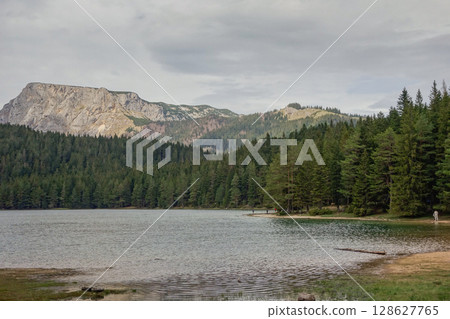 the Black lake with mountainrange in background in Durmitor National Park, Zabljak, Montenegro 128627765