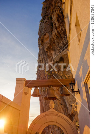 Dabovici, Montenegro - 05.05.2025: Ostrog Monastery, of Serbian Orthodox Church, nestled in rocky hillside 128627842