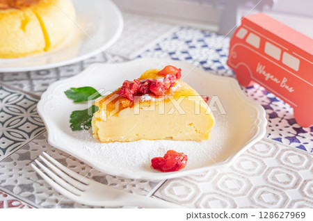 Yogurt cake topped with frozen strawberries 128627969