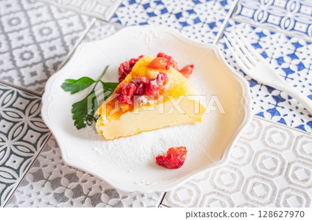 Yogurt cake topped with frozen strawberries 128627970