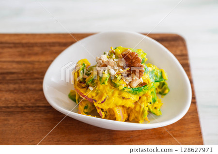 Pumpkin salad with snow peas 128627971