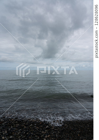 Waves of the Black Sea in Batumi. Stone beach and waves Waves of the Black Sea in Batumi. Stone beach and waves 128628096