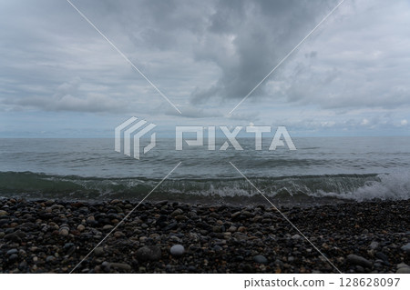 Waves of the Black Sea in Batumi. Stone beach and waves Waves of the Black Sea in Batumi. Stone beach and waves 128628097