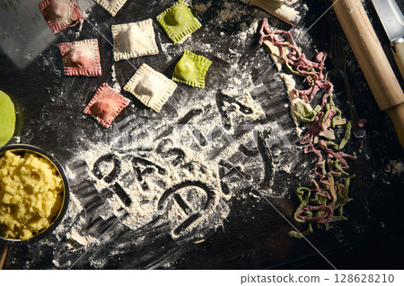 Celebrating National Pasta Day with Homemade Ravioli and Colorful Italian Pasta 128628210
