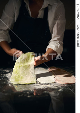 Homemade Pasta Making Highlighting Green, White, and Red Dough with Italian Inspiration 128628281