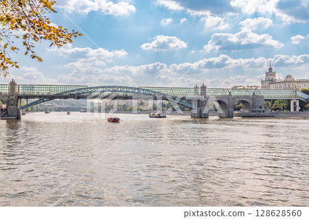 View of the Moscow river embankment, Pushkinsky bridge and cruise ships at sunset. 128628560