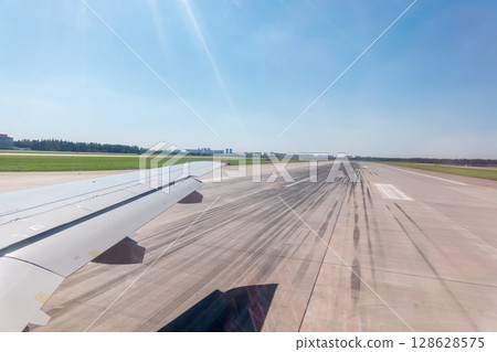 View from the airplane window during takeoff at Sheremetyevo airport at summer 128628575