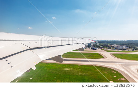 View from the airplane window during takeoff at Sheremetyevo airport at summer 128628576
