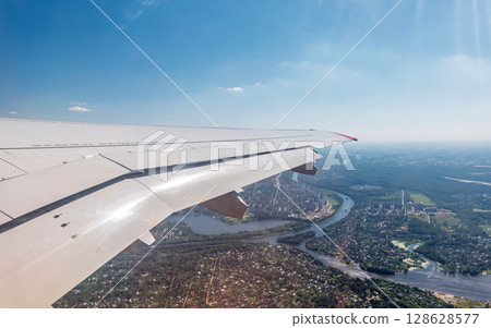View from the airplane window during takeoff at Sheremetyevo airport at summer View from the airplane window during takeoff at Sheremetyevo airport at summer 128628577
