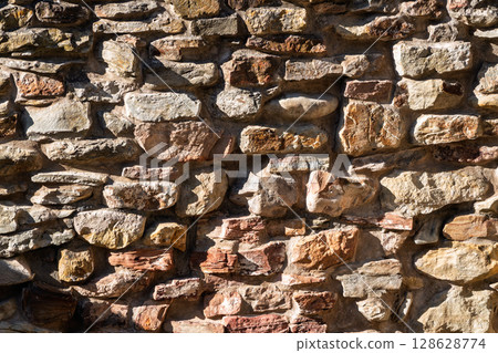 Backgrounds of the old stone wall. 128628774