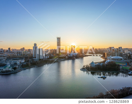 Yekaterinburg aerial panoramic view in spring at sunset. Yekaterinburg city and pond in spring or autumn. 128628869