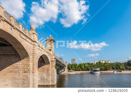 View of the Moscow river embankment, Pushkinsky bridge and cruise ships at sunset. 128629205