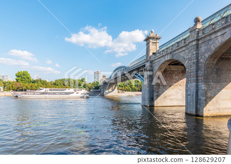 View of the Moscow river embankment, Pushkinsky bridge and cruise ships at sunset. 128629207