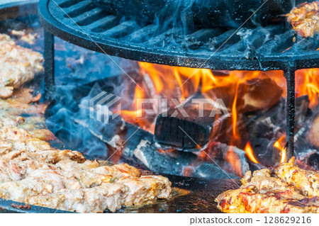 Steak on the grill with flames Steak on the grill with flames 128629216