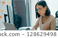Young adult Asia female freelance eyeglasses typing write prompt AI bot IT app smart program nomad, video game, terminal with coding, user interface, designer, big data center on desktop computer. 128629498