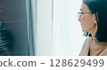 Closeup young adult Asia female freelance eyeglasses typing write prompt AI bot IT app program nomad, video game, terminal with coding, user interface, designer, big data center on desktop computer. 128629499