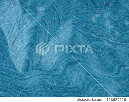 A tranquil sea of jade washes over this unique poplar burl veneer, with waves of verdant tones swirling in harmony 128629616