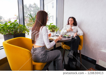 Professionals revise their marketing voice and digital assets. Concept of team branding and communication. 128630413