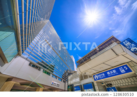 Yokohama cityscape in Japan in July. Intense heat...SOTETSU Yokohama Station and sunlight. 128630510