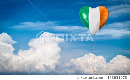 Irish flag heart shaped balloon and blue sky 128631978