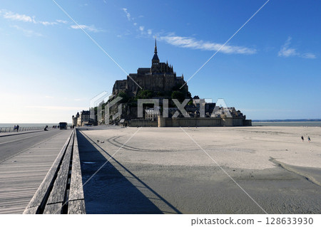 Spectacular view of Mont Saint-Michel and blue sky at low tide Spectacular view of Mont Saint-Michel and blue sky at low tide 128633930