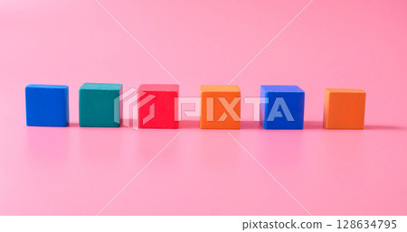 Colored children wood cubes on background.children playing. 128634795