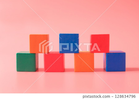 Colored children wood cubes on background.children playing. Colored children wood cubes on background.children playing. 128634796