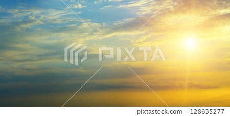 Beautiful sky background - Sunset (Sunrise) sky with light clouds. 128635277