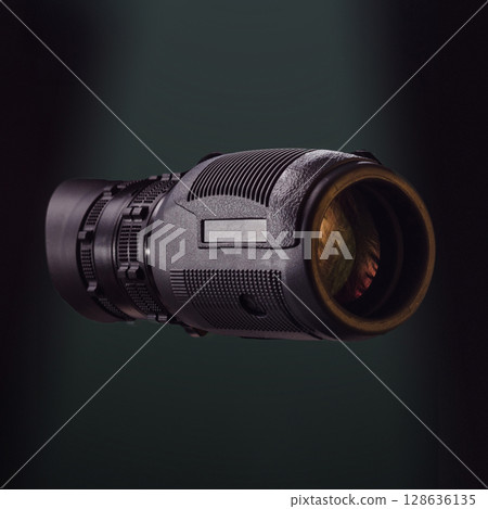Black monocular on green photo. Beautiful photo of a monocular. Optics for hunters and tourists. Optics for observation. Black monocular on green photo. Beautiful photo of a monocular. Optics for hunters and tourists. Optics for observation. 128636135