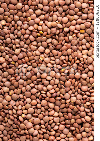 Organic brown lentil food background Organic brown lentil food background 128636210