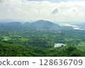 View of the beautiful jungle depths of Yanoda Park on Hainan Island, China. 128636709