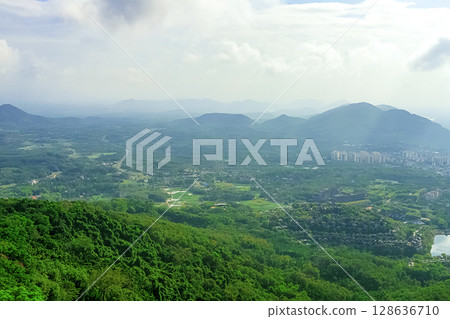 View of the beautiful jungle depths of Yanoda Park on Hainan Island, China. 128636710