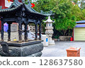 Hainan Island, Sanya: Nanshan Buddhist Center. View of the incense burner in front of the Temple 128637580