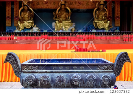 Hainan Island, Sanya: Nanshan Buddhist Center. View of the incense burner in front of the Temple Hainan Island, Sanya: Nanshan Buddhist Center. View of the incense burner in front of the Temple 128637582