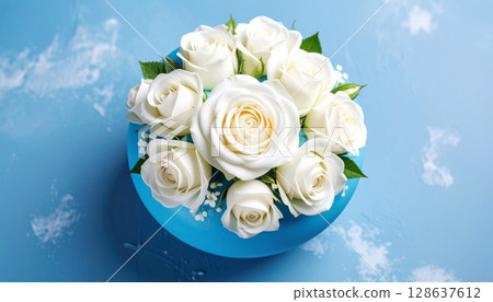 Roses on a blue plate 128637612