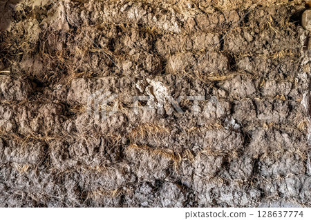 Walls of a sod house at the Prairie Homestead outside the Badlands National Park in South Dakota  128637774