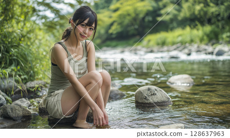 A young woman cools off by the river 128637963