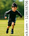 Child practicing running in the park 128638706