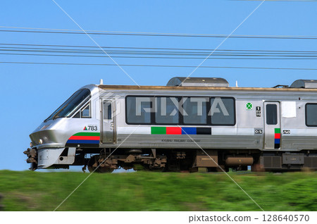 JR Kyushu's 783 series train running against a blue sky 128640570