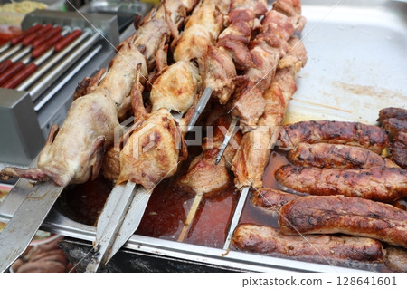 Savor the Delicious Grilled Meats Served on Skewers at a Vibrant Street Food Market Savor the Delicious Grilled Meats Served on Skewers at a Vibrant Street Food Market 128641601
