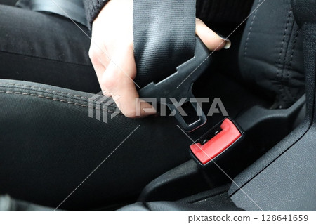 Fastening the Seatbelt in a Car is Essential for Your Safety and Overall WellBeing Fastening the Seatbelt in a Car is Essential for Your Safety and Overall WellBeing 128641659