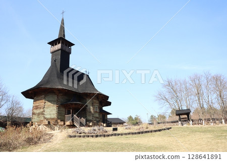A Historic Wooden Church Surrounded by Nature Featuring a Unique and Stunning Architecture 128641891