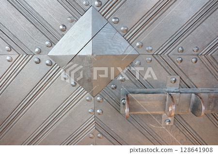 Intricate and beautiful Metallic Door Design that features captivating Geometric Features 128641908