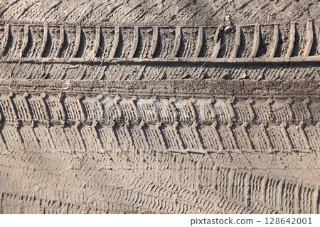The Intricate Details of Tire Tread Patterns Imprinted on Various Ground Surfaces The Intricate Details of Tire Tread Patterns Imprinted on Various Ground Surfaces 128642001