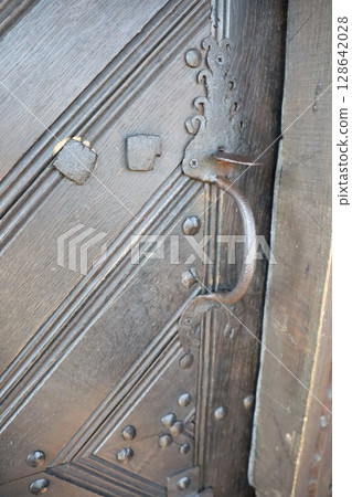 Artistic Ironwork on a Stunningly Designed Door That Showcases Unique Craftsmanship 128642028